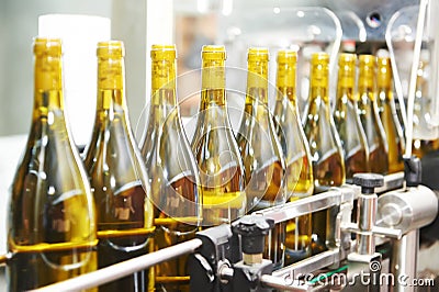 Bottling and seaaling conveyor line at winery factory Stock Photo