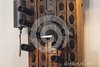 Bottom of a bottle of wine in the rack and a lamp in retro style Stock Photo