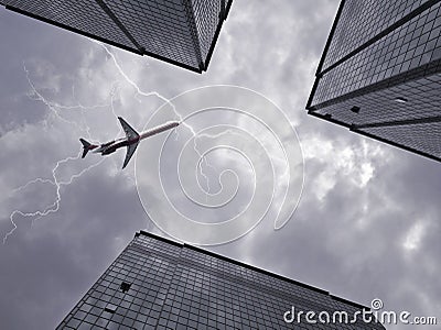 Bottom view of airplane flying above skyscraper Stock Photo