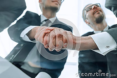 bottom view.businessmen shaking hands at the negotiating table Stock Photo