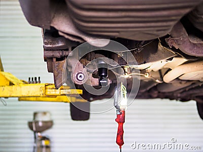 Bottom view of car with new shock absorbers Stock Photo