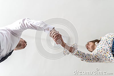 Bottom view of a handshake of a businessman and woman Stock Photo