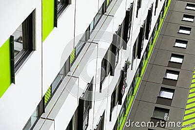 Bottom view of high new multiple dwelling of white, green and grey colors Stock Photo