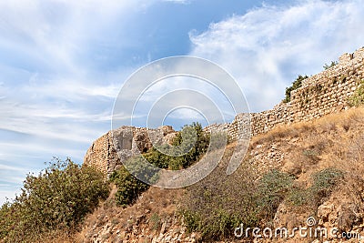 Bottom view of the hill with the ruins of the fortress walls and the corner tower of the medieval fortress of Nimrod - Qalaat al- Stock Photo
