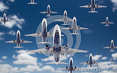 Bottom View of Several Passenger Airplanes Flying In The Blue Sky Stock Photo