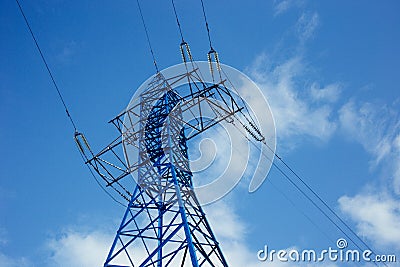 bottom view of the tower of power grids on blue sky background, High voltage, Electricity concept Stock Photo