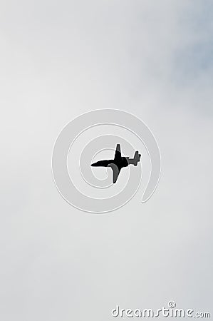 Silhouette of a private jet flying over tropical sea Stock Photo