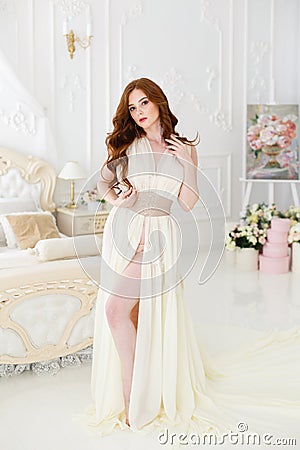 Boudoir Bride`s morning. Cute red-haired girl in her wedding day Stock Photo
