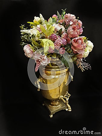 A bouguet of flowers in a samovar Stock Photo