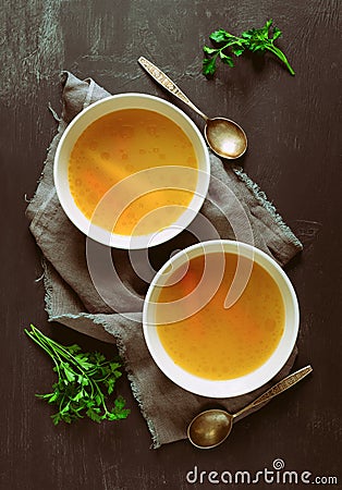 Bouillon served in two bowls Stock Photo