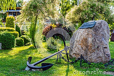 Boulder and anchor as an monument for 50 years of Yacht Club AZS Szczecin Editorial Stock Photo