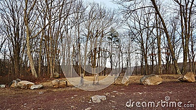 Boulders and Tree Stumps Forming Natural Barrier in Nature Site Parking Area Stock Photo