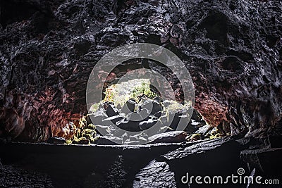 Boulders and walls in Kaumana lava cave Stock Photo