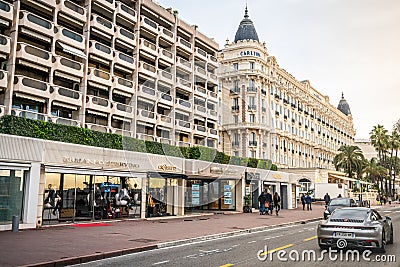 Boulevard de la Croisette street view with luxury shops and Intercontinental Carlton hotel in Cannes France Editorial Stock Photo