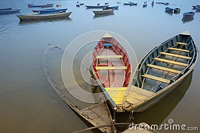 Bound boats in contrary colors Stock Photo