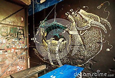 Bound and hung goat , unknown artist graffiti in outdoor bar Editorial Stock Photo