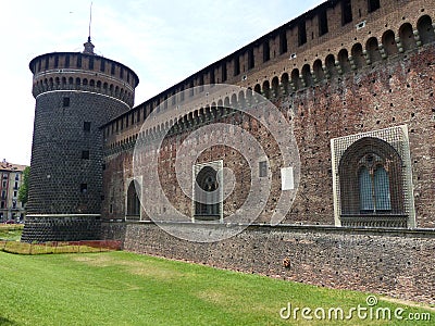 Boundaries and cylindrical tower of the castle Sforzesco to Milan in Italy. Editorial Stock Photo