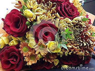 Bouqette of flowers with roses and camomile Stock Photo