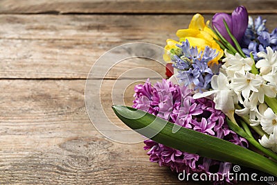 Bouquet of beautiful spring flowers on wooden table, closeup. Space for text Stock Photo