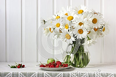 Bouquet of chamomiles in a jug Stock Photo