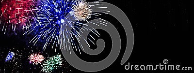 Bouquet of colorful fireworks flowers displayed on the night sky Stock Photo