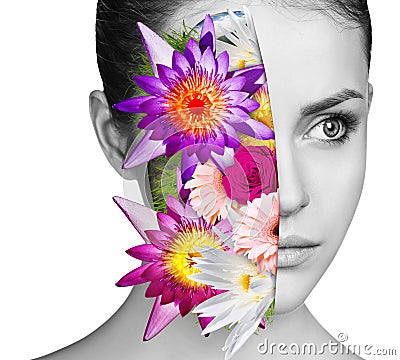 Bouquet of colorful flowers inside young woman`s face. Stock Photo