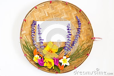 Bouquet of colorful flowers on threshing basket Stock Photo