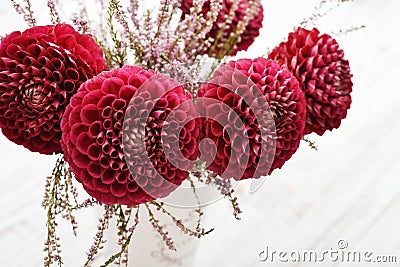 Bouquet of dahlias in vintage vase Stock Photo