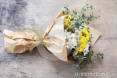 Bouquet daisy chamomile flowers on wooden garden table. Stock Photo