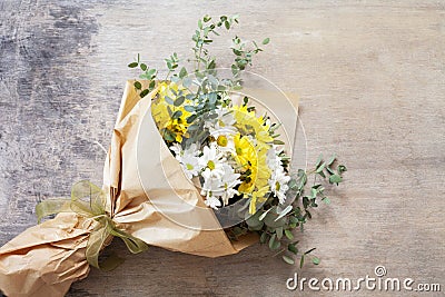 Bouquet daisy chamomile flowers on wooden garden table. Stock Photo