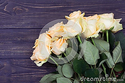 Bouquet of roses on a wooden background Stock Photo
