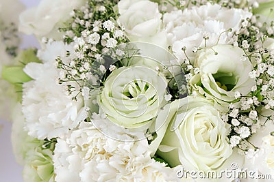 Bouquet Floral arrangement white roses carnation and gypsophila paniculata Stock Photo