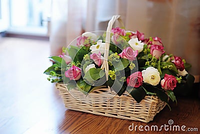 Bouquet of flowers in basket Stock Photo