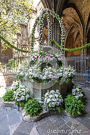 Bouquet of flowers in courtyard of Cathedral of the Holy Cross and Saint Eulalia in Gothic quarter, Barcelona, Spain Stock Photo