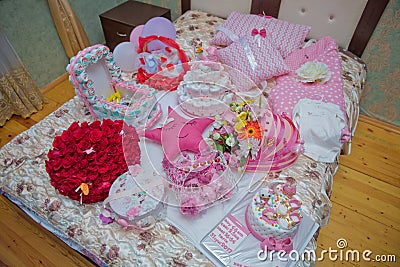 A bouquet of flowers bouquet of a hundred red roses . The handle of the engagement red basket . Engagement pink iron basket . Editorial Stock Photo