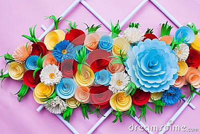 bouquet of flowers made with paper on a pink surface Stock Photo