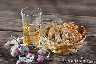 Bouquet of fresh beer and snacks with homemade, salted, rye rusks with garlic for beer. Stock Photo