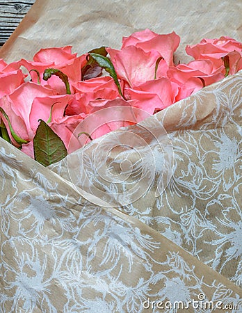 Bouquet of gift wrapped pink roses Stock Photo