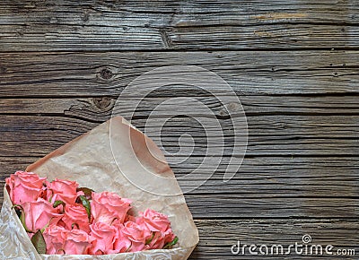 Bouquet of gift wrapped pink roses Stock Photo