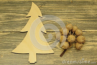 Christmas tree made of wood and decorative apples on a dark wooden background Stock Photo