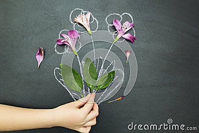 Bouquet in hand on a black background Stock Photo