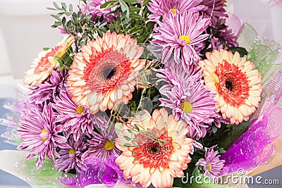 bouquet of large fresh orange gerbera chamomile and pink chrysanthemums Stock Photo