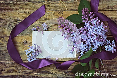 Bouquet lilac branches and blank greeting card Stock Photo