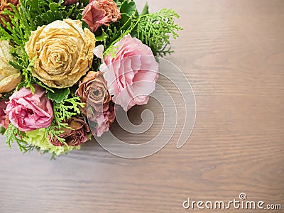 Bouquet of mixed flowers on wood background, Roses, Carnation, Eustoma, dry flowers Stock Photo