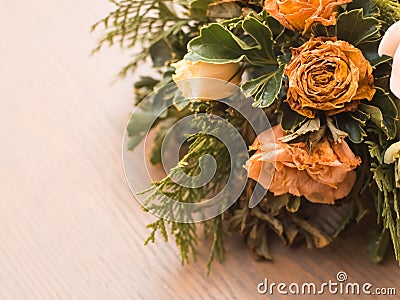 Bouquet of mixed flowers on wood background, Roses, Carnation, Eustoma, dry flowers Stock Photo