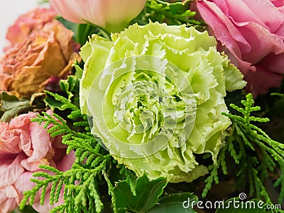 Bouquet of mixed flowers on wood background, Roses, Carnation, Eustoma, dry flowers Stock Photo