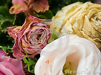 Bouquet of mixed flowers on wood background, Roses, Carnation, Eustoma, dry flowers Stock Photo