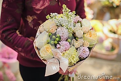Bouquet of pink flowers decorated with leaves Stock Photo