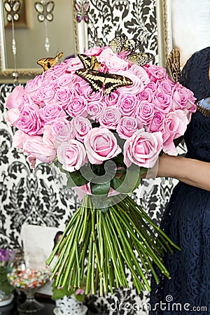 Bouquet of pink roses with live butterflies Stock Photo
