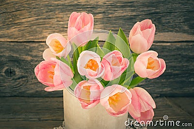 Bouquet of pink tulips in vase. Vintage style, toned, Stock Photo